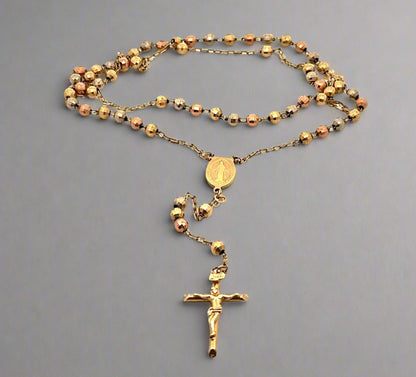 14K multi color gold rosary with a yellow gold cross. The chain is double up to fit in the photo
