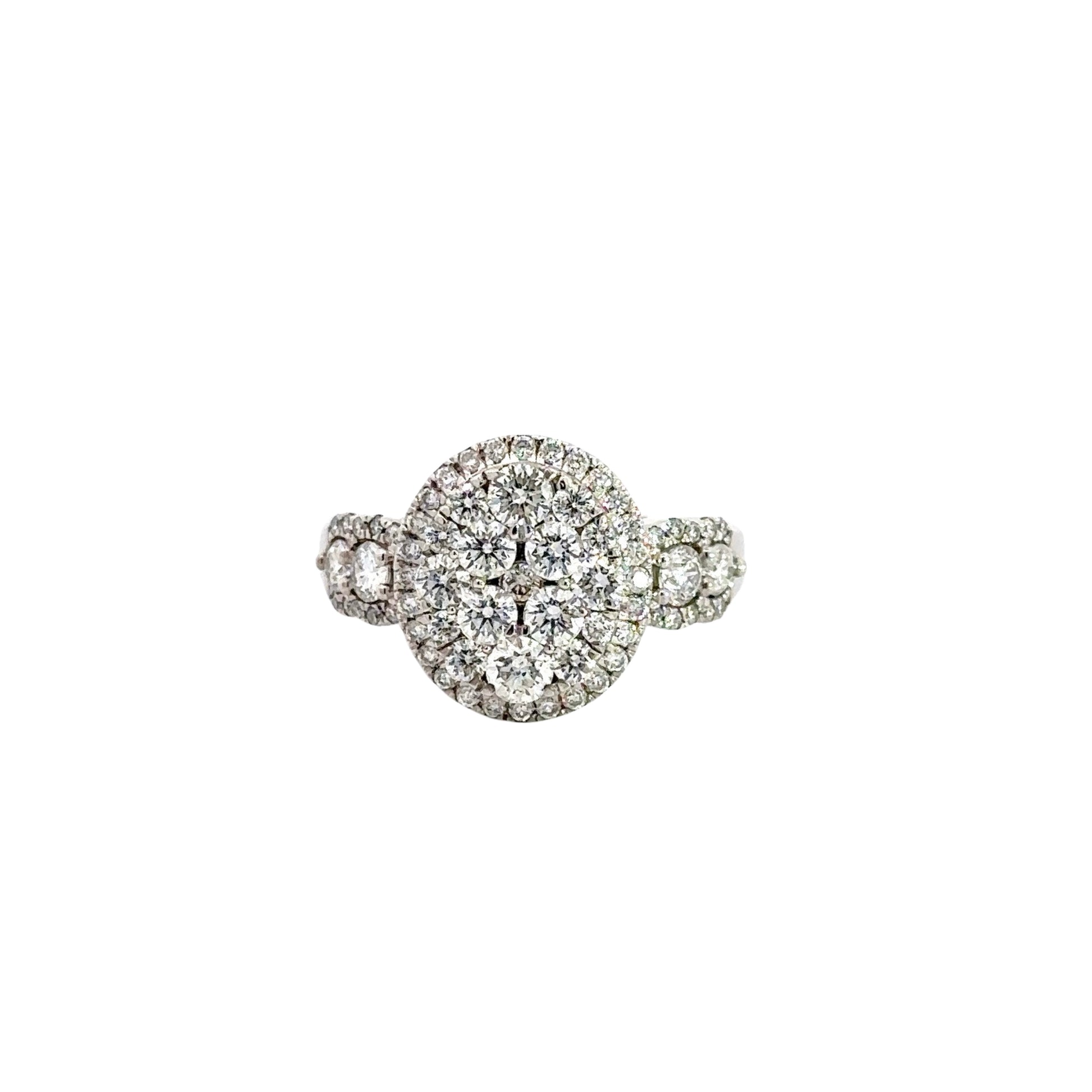 Front of white gold oval-shaped diamond cluster ring with round diamonds in various sizes.