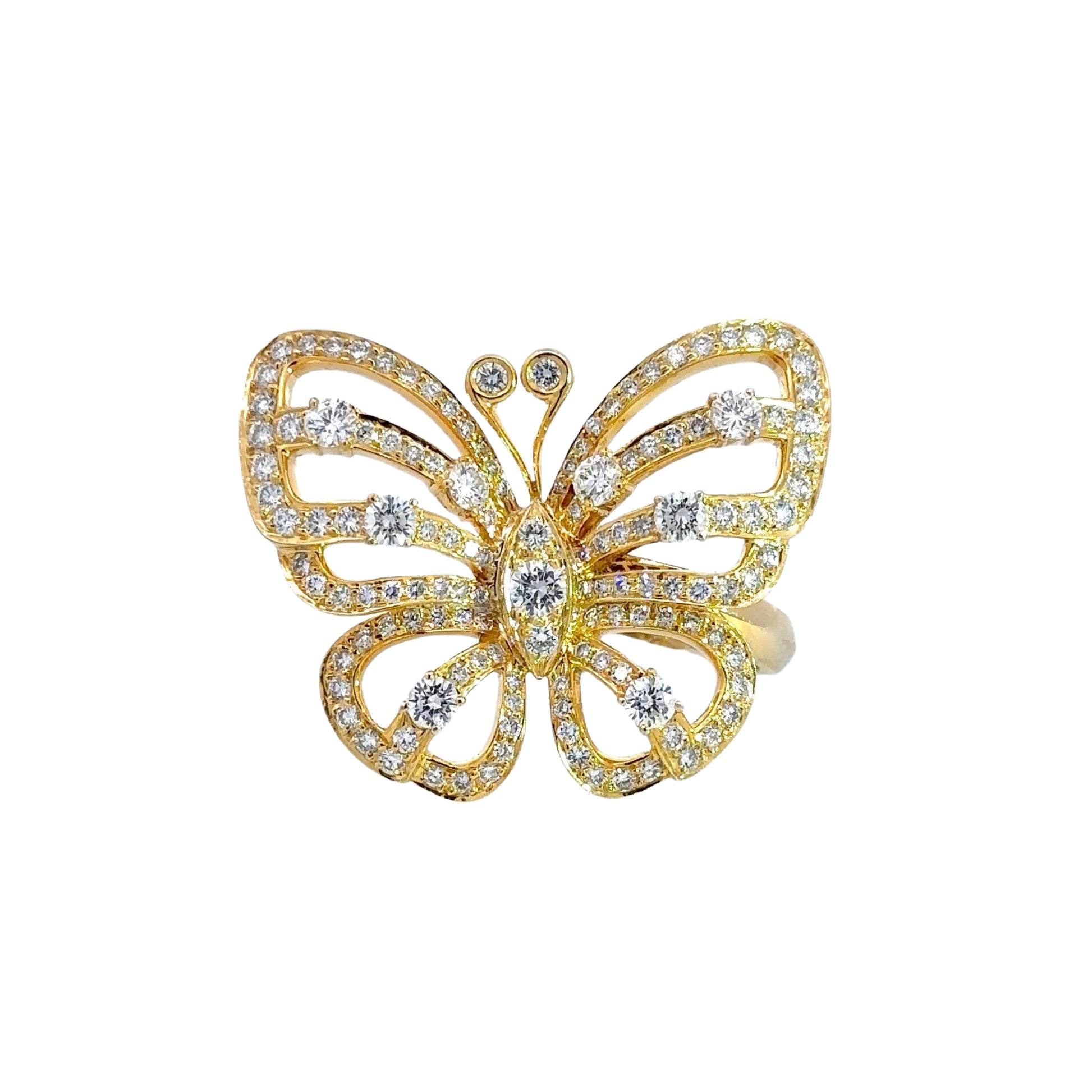 front of yellow gold diamond butterfly ring. The butterfly sits off center of the ring so it's not in the center of the finger and appears to be flying.