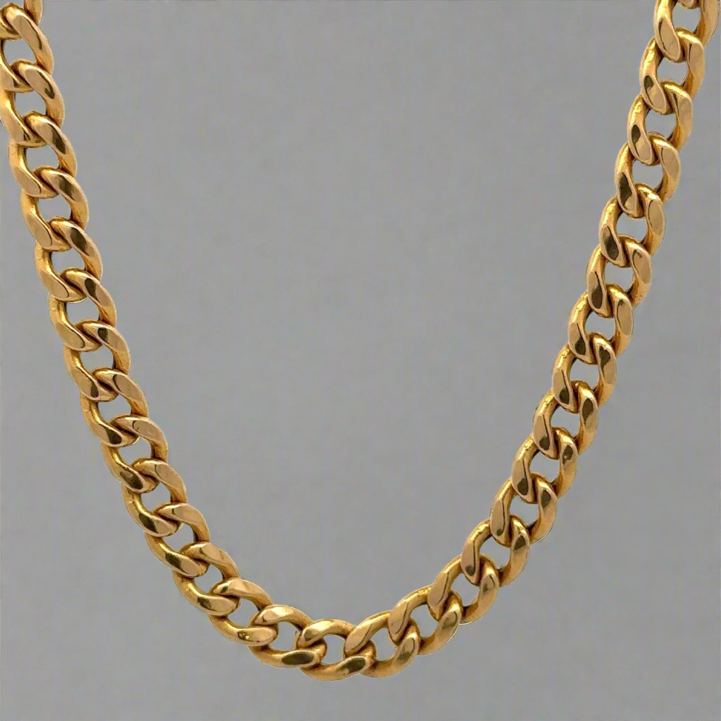 Front of yellow gold cuban link chain