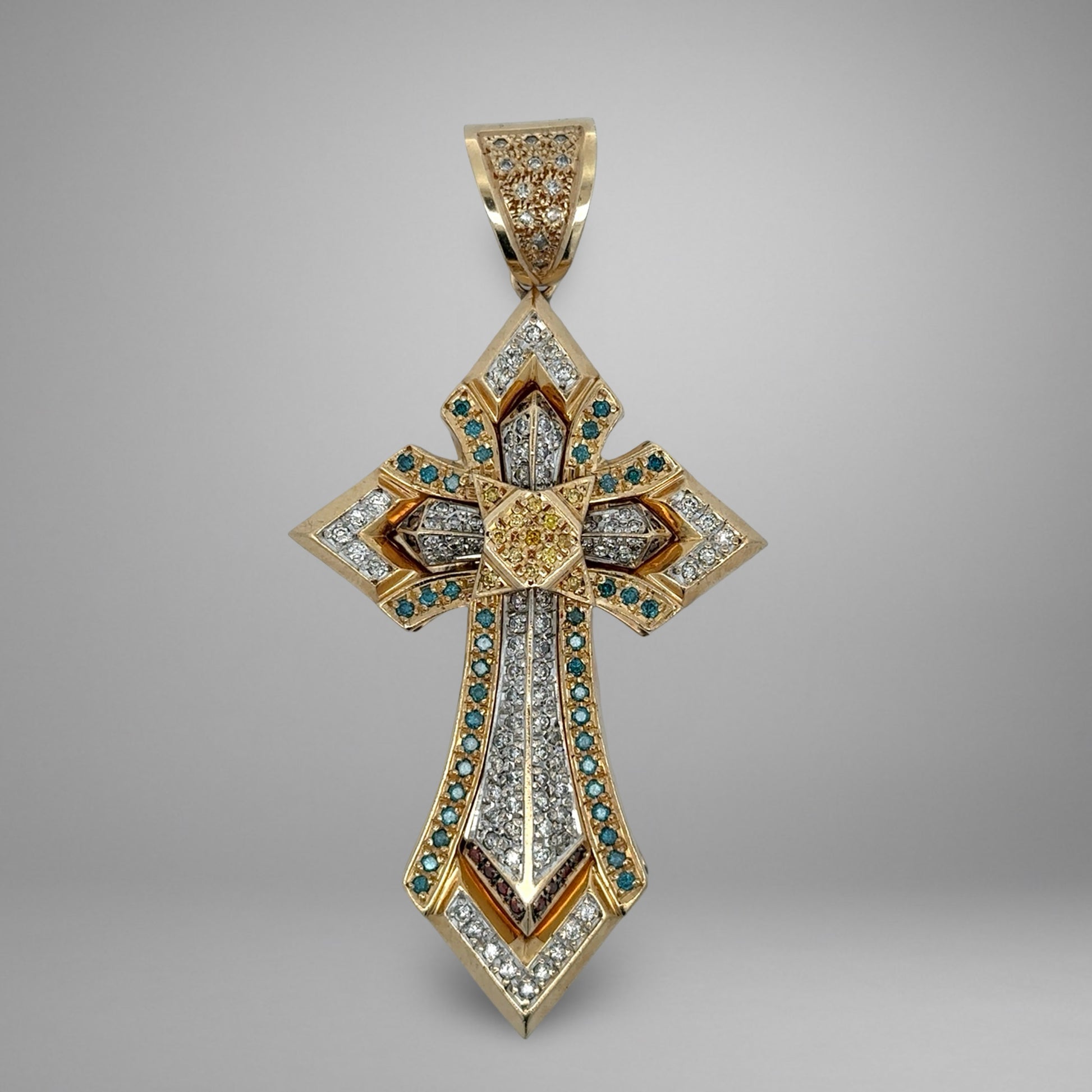 Yellow gold cross with white, yellow, brown, and blue diamonds