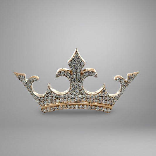 Gold crown with diamond accents on a gray background