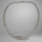 Diamond necklace on a gray background