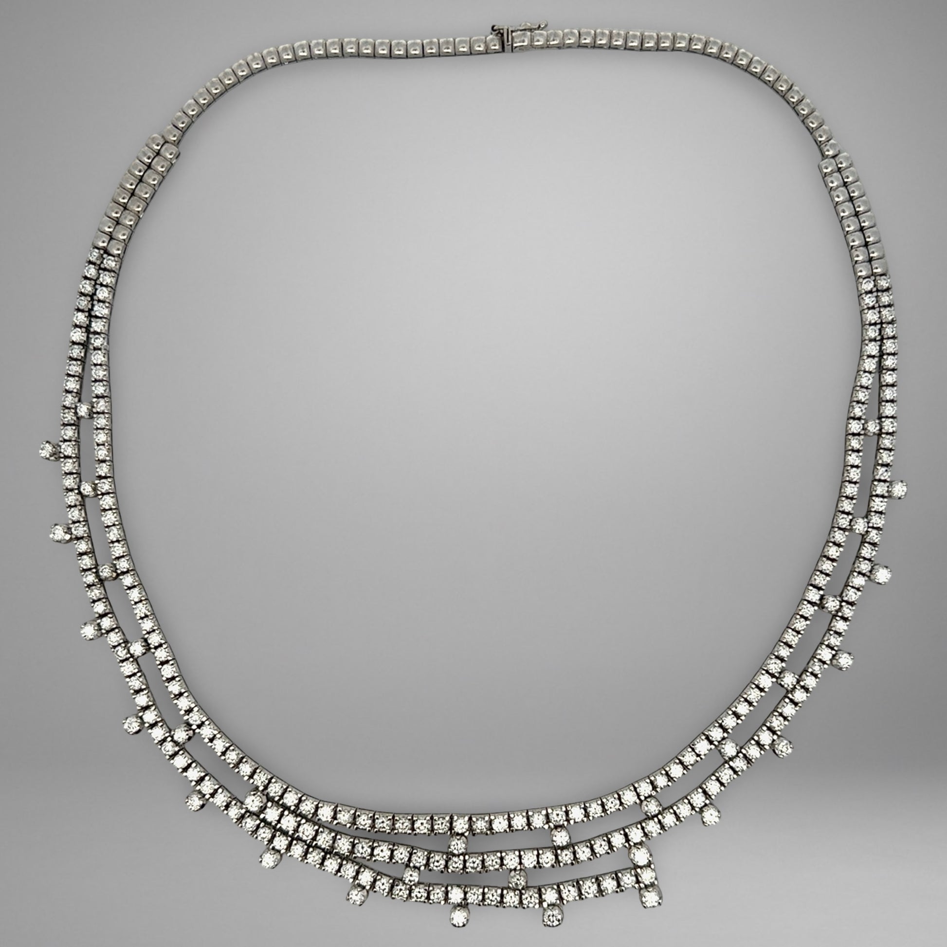 Diamond necklace on a gray background