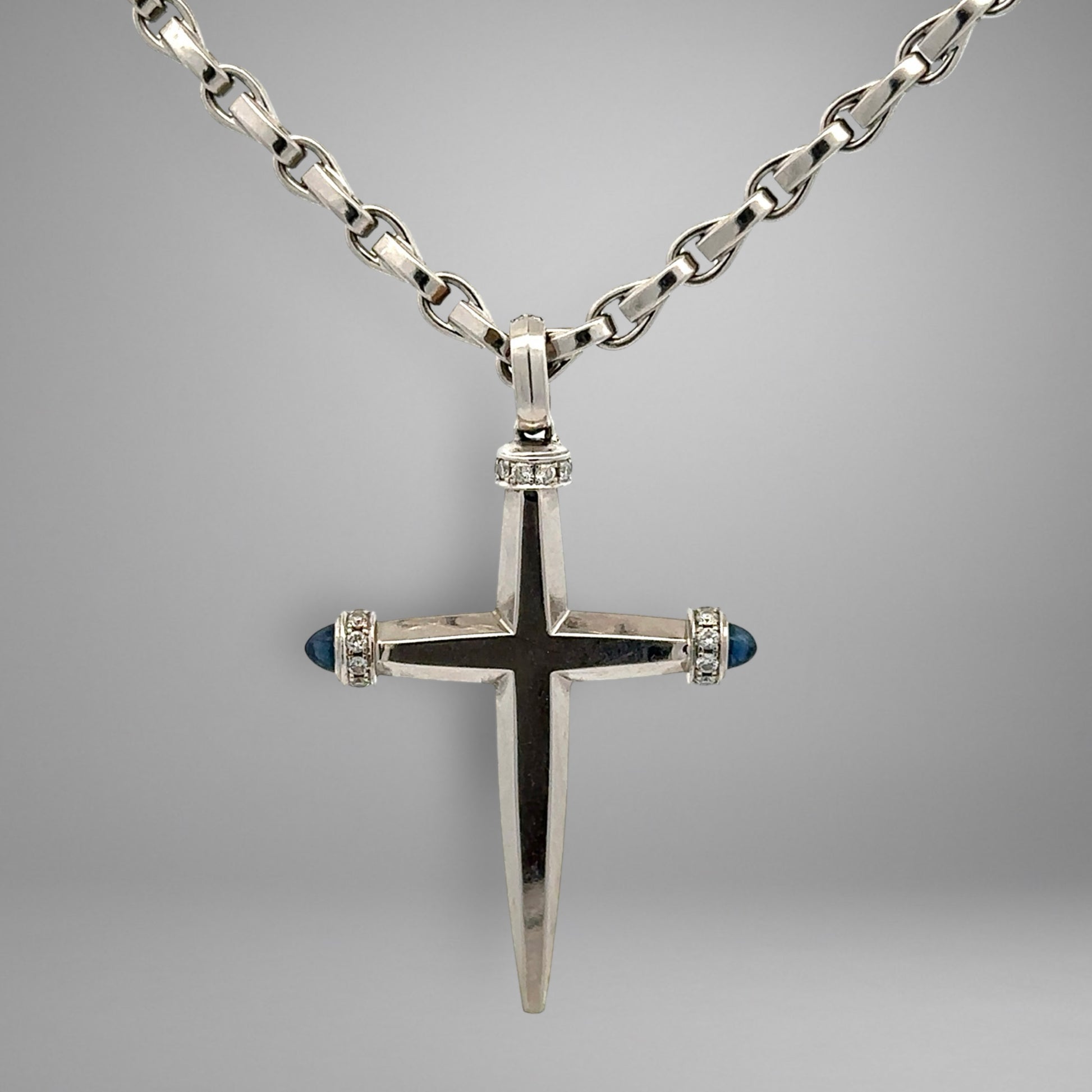 White gold link chain & cross pendant with diamonds and blue gemstones