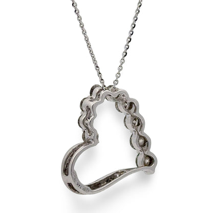 Back of an open heart shaped pendant with 14K stamp