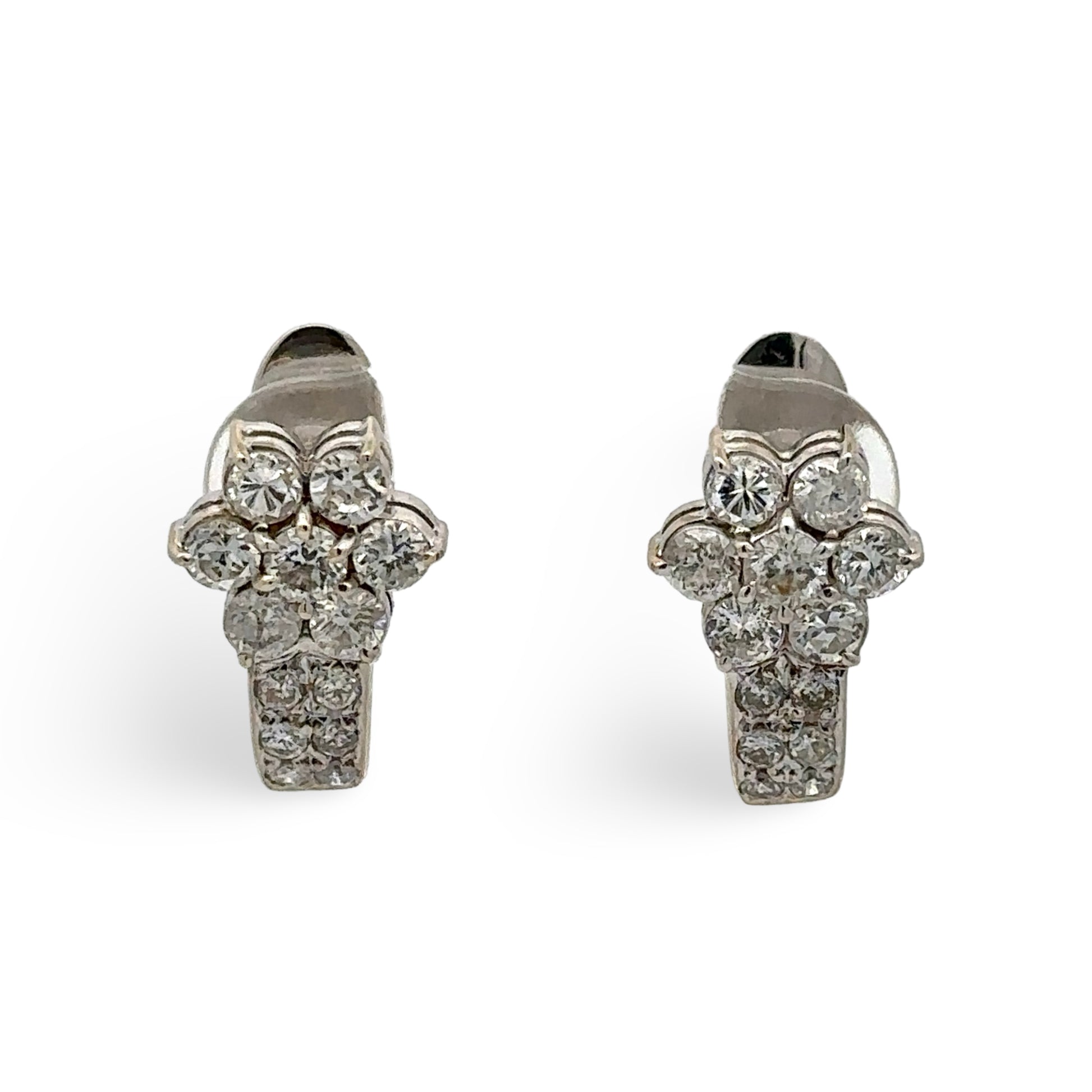 Pair of diamond earrings on a white background