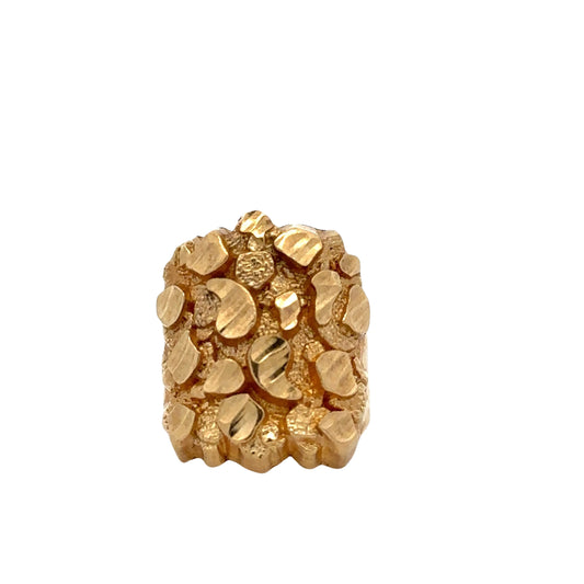 Front of yellow gold nugget ring. The shape is elongated in front of ring