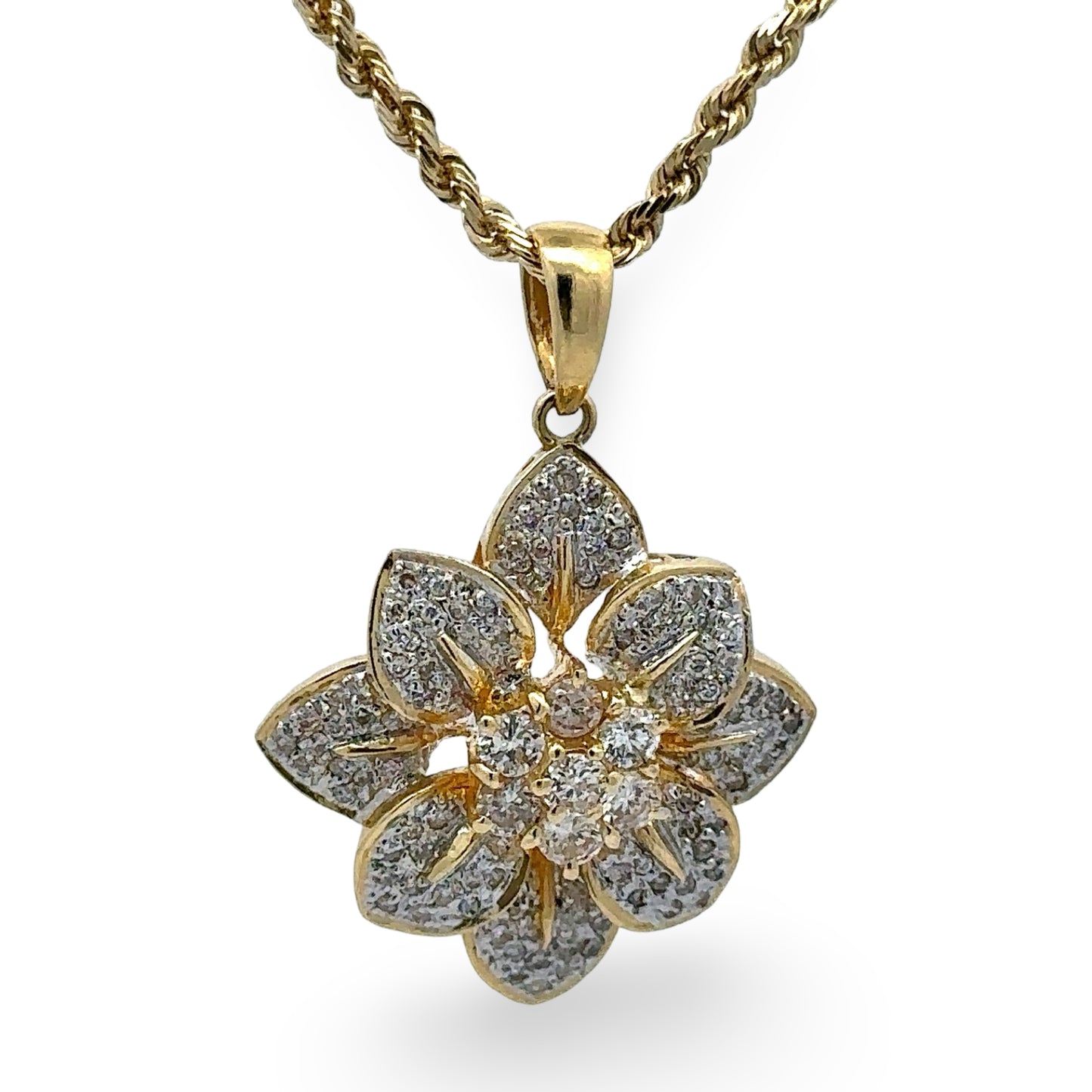Gold and diamond flower-shaped pendant on a white background