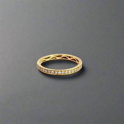 Side of yellow gold ring with small round diamonds.