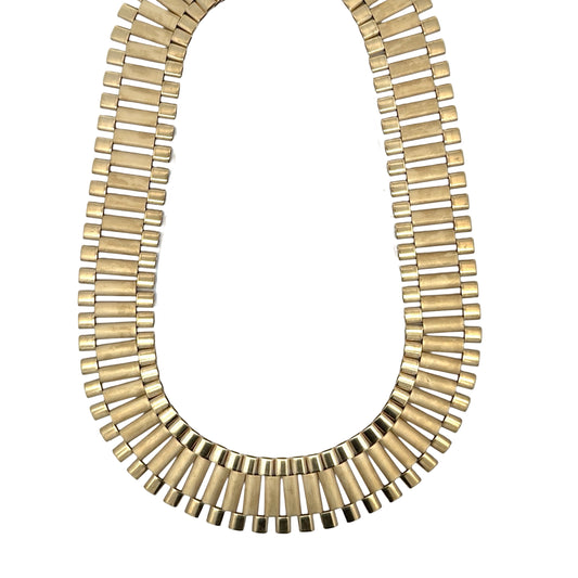 Yellow gold rolex chain on white background