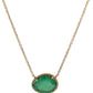 Hanging yellow gold necklace with a free-form emerald and small round diamonds around it
