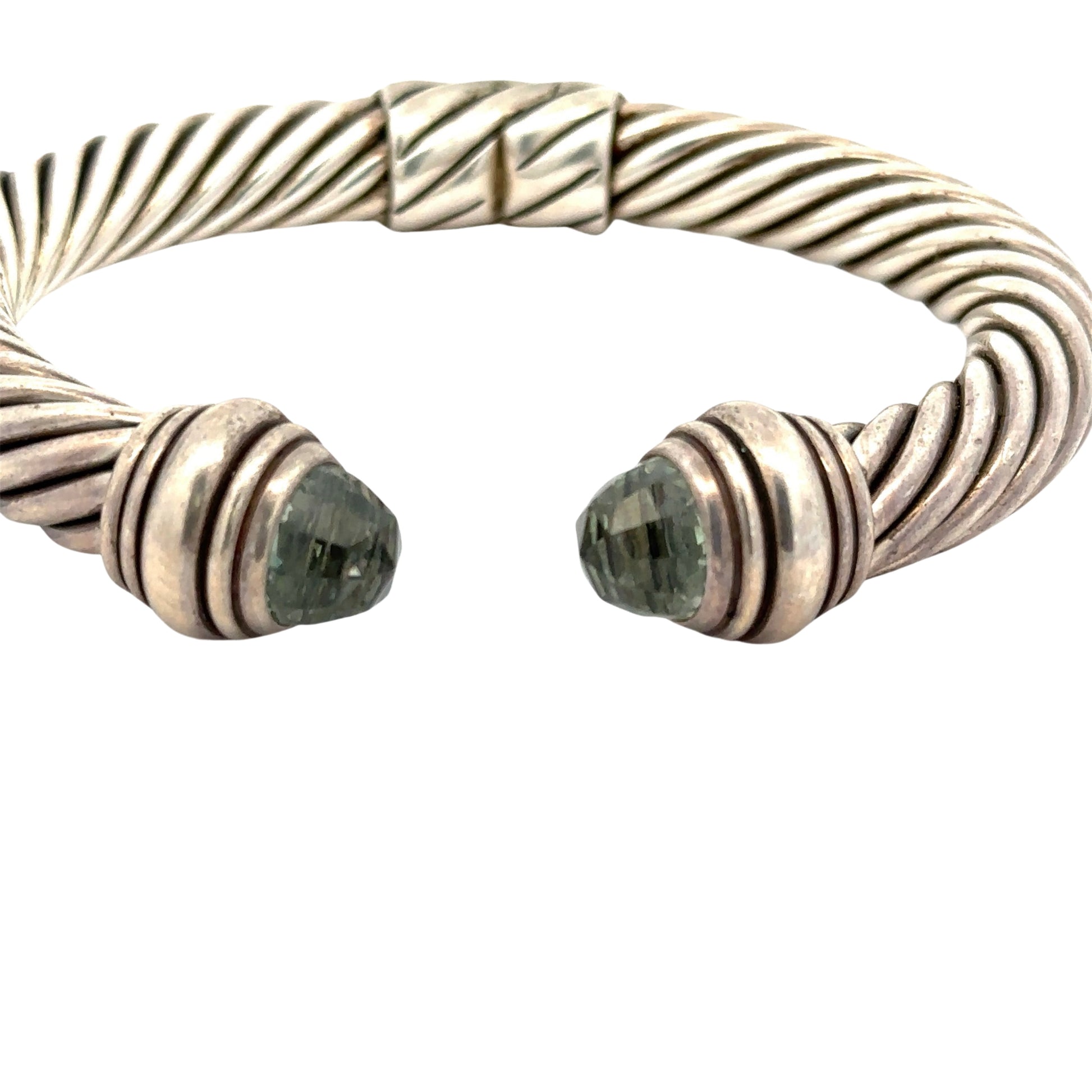 Front of open silver textured bracelet with 2 dome-shaped Prasiolite Gemstones- yellowish green color. Scratches on silver.