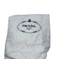 Pictured: The white dustbag for the Prada Galleria Crystal mini satin bag. It has wrinkles and small marks on the bag. It says "Prada Milano"