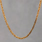 Hanging yellow gold byzantine chain