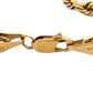 close up 14K yellow gold lobster clasp with scratches on gold