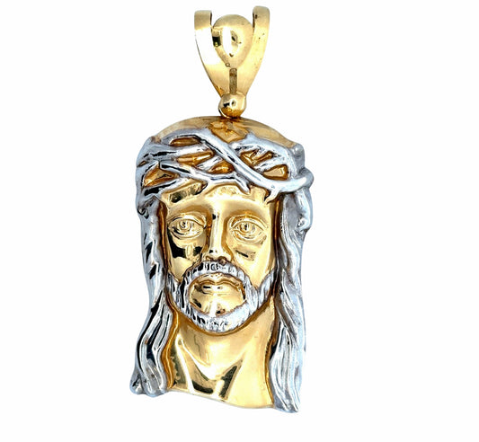 Front of yellow + white gold jesus pendant with white gold hair + facial hair.