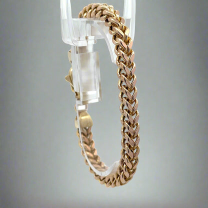 Diagonal view of square franco bracelet in yellow gold