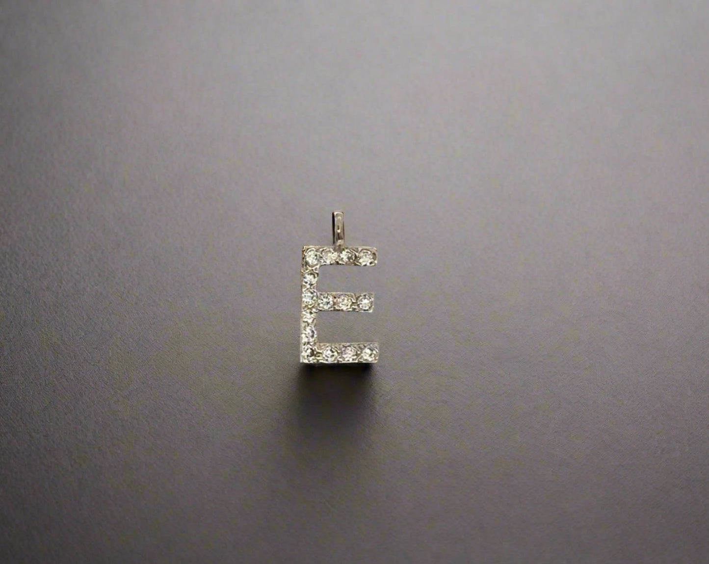 Front of diamond E pendant