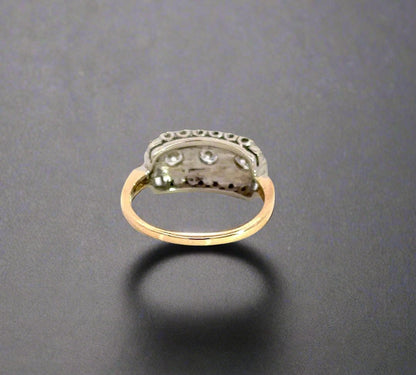 Back of yellow gold ring with marks on bottom of band