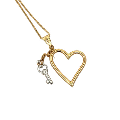 Back of heart + key necklace. Shows some scratches on bail 