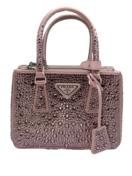 Pictured: The front of the Prada Galleria Crystal mini satin bag in pink covered with pink crystals. No imperfections.