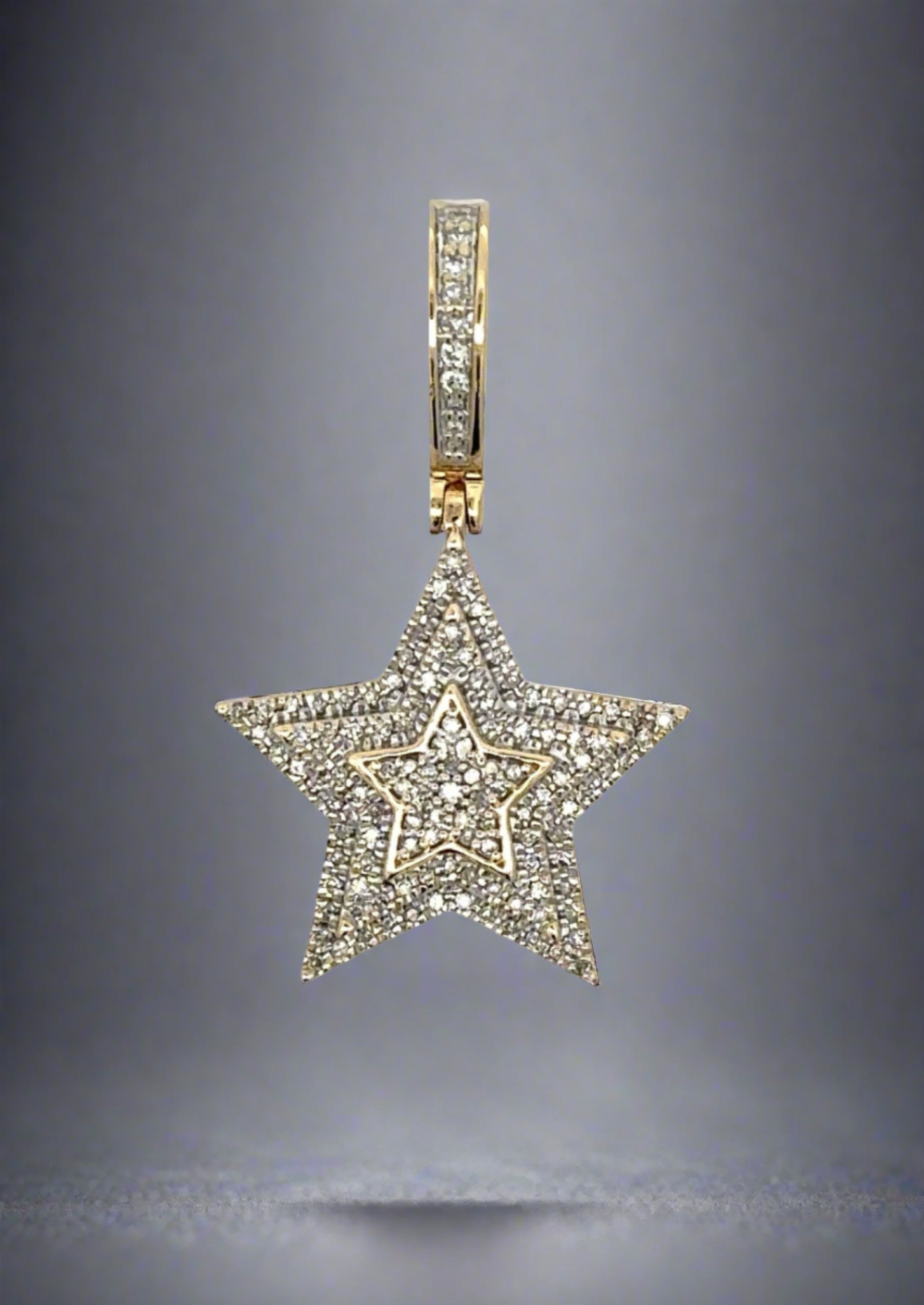 Front of diamond star pendant with diamonds on the bail and the star