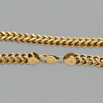 Close up of lobster clasp with 14K stamp and marks on clasp