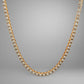 Gold necklace with diamonds on a gray background