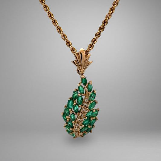 yellow gold necklace with green gemstones and diamonds