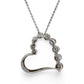 Back of an open heart shaped pendant on a chain against a white background