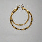 side of yellow gold twist hoops