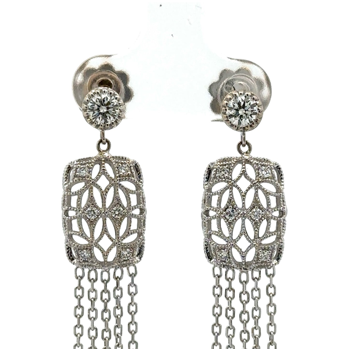 Close up of white gold diamond chandelier earrings