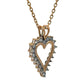 Heart-shaped diamond pendant on a gold chain against a white background