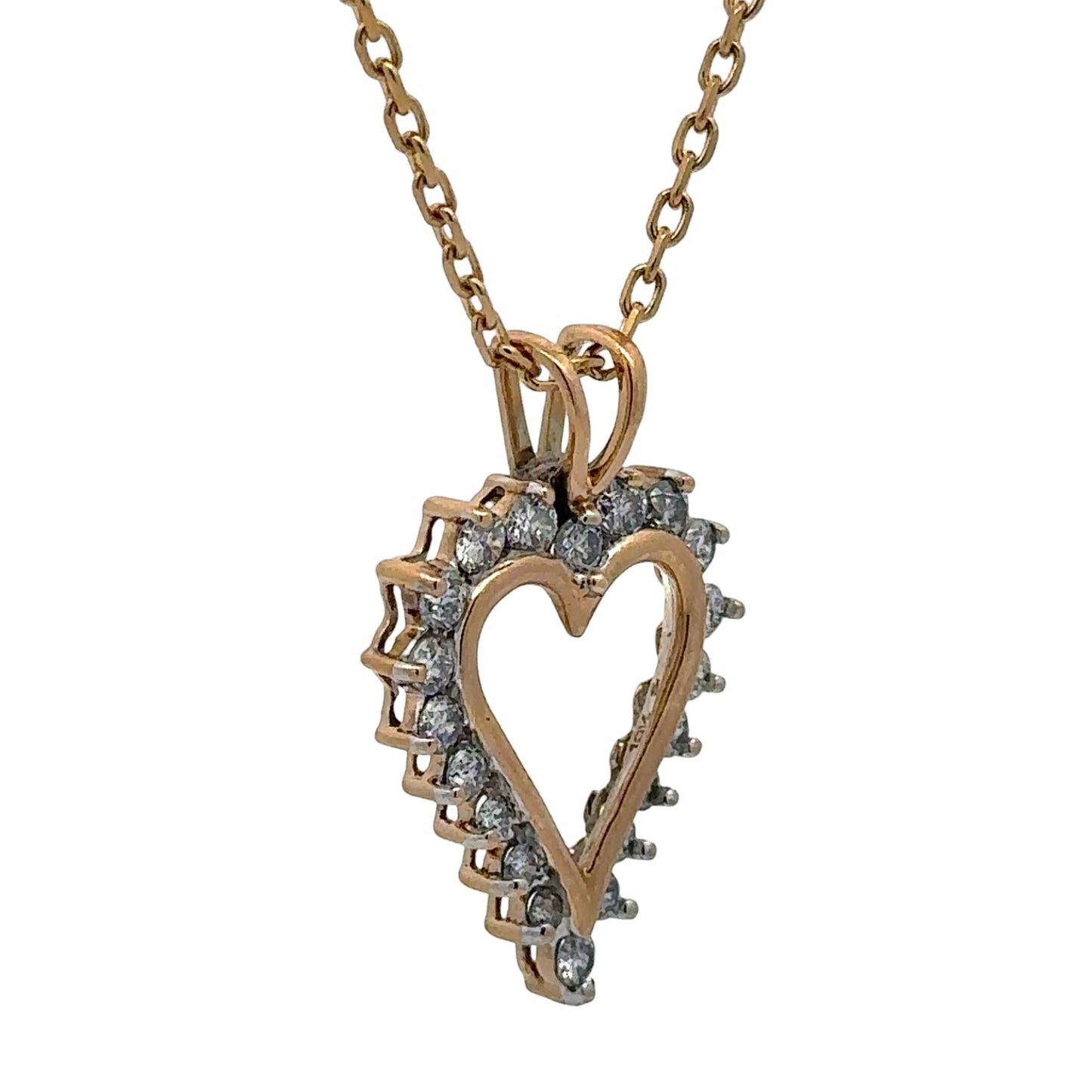 Heart-shaped diamond pendant on a gold chain against a white background