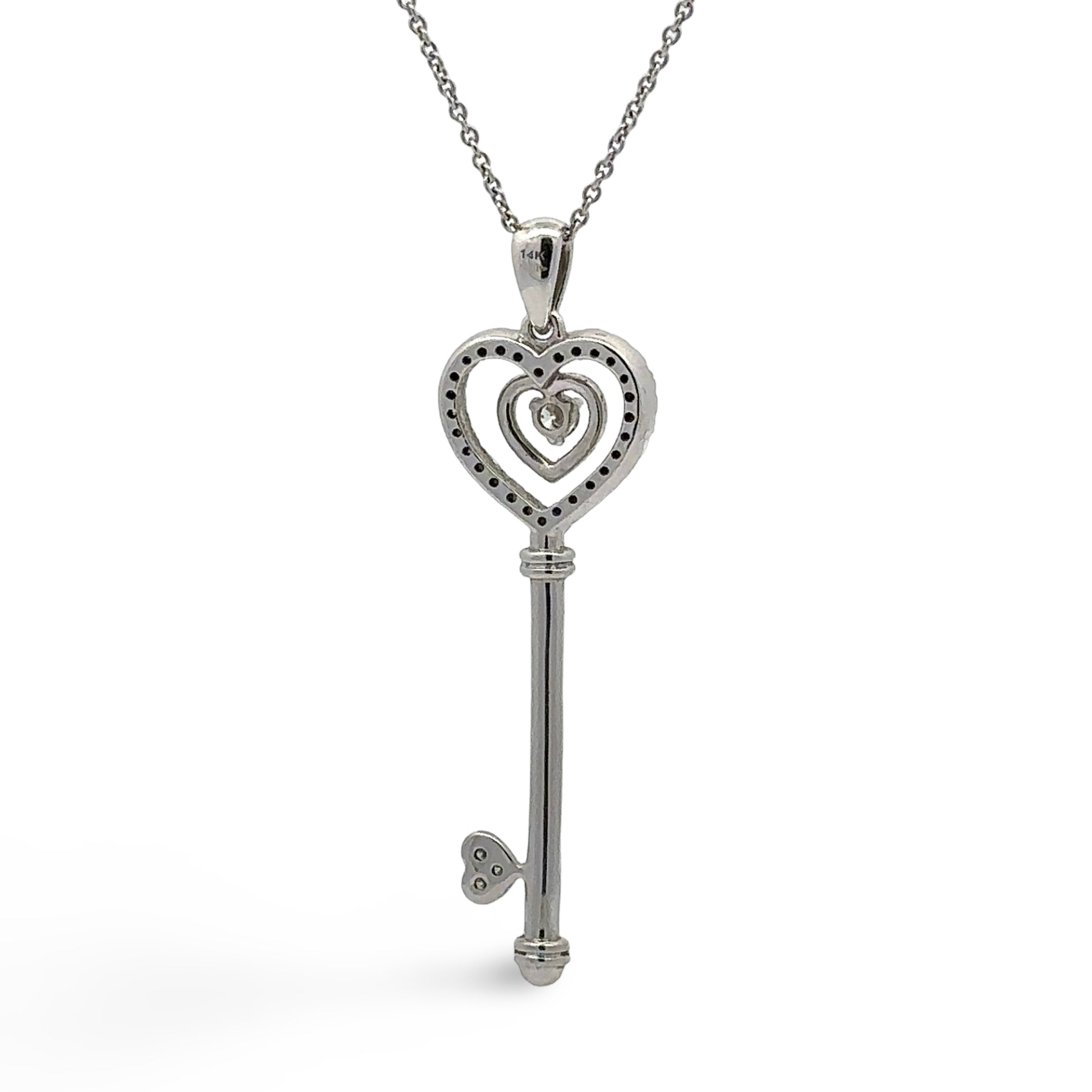 Back of white gold heart key pendant with 14K stamp