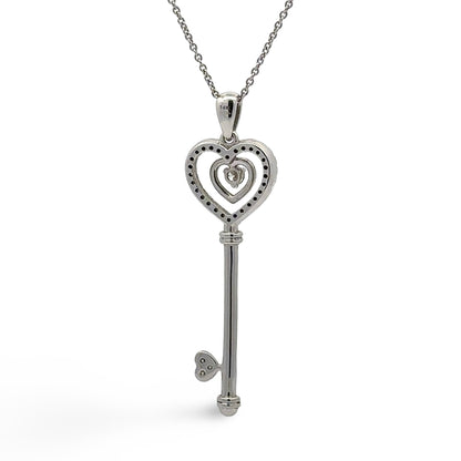 Back of white gold heart key pendant with 14K stamp