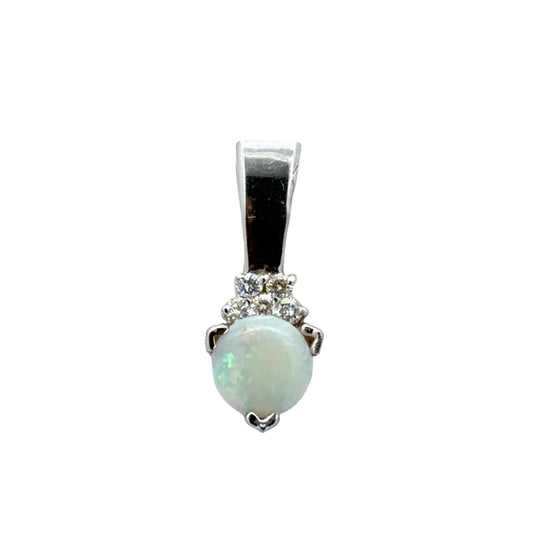 Opal and diamond pendant with white gold setting on a white background