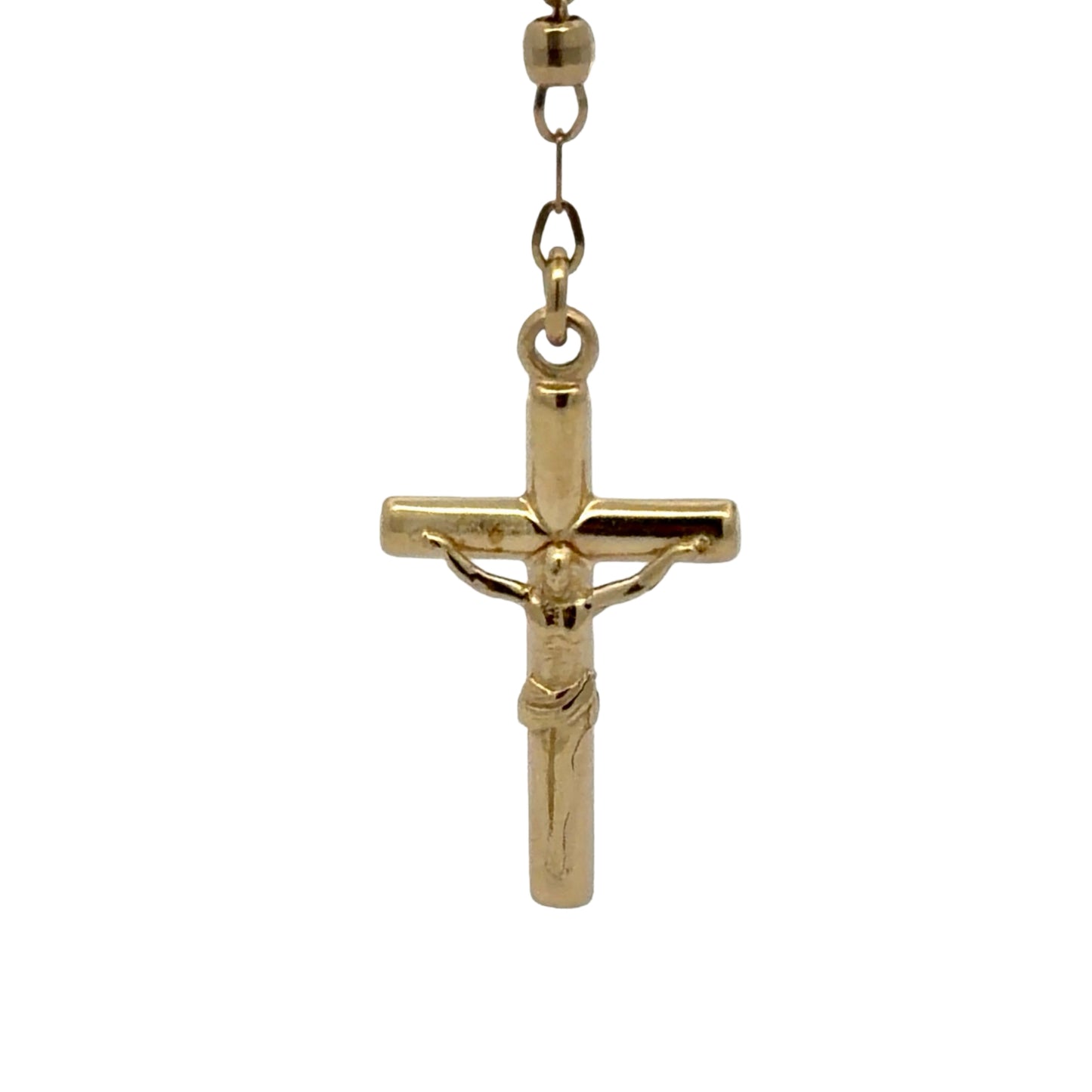 Gold crucifix pendant on a white background