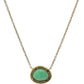 back of necklace with yellow gold surrounding free-form emerald
