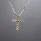 Back of white gold cross with open back