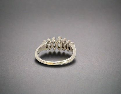 back of white gold diamond ring with scratches on gold