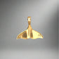 back of yellow gold whale tail pendant with "PR" + 14K stamp