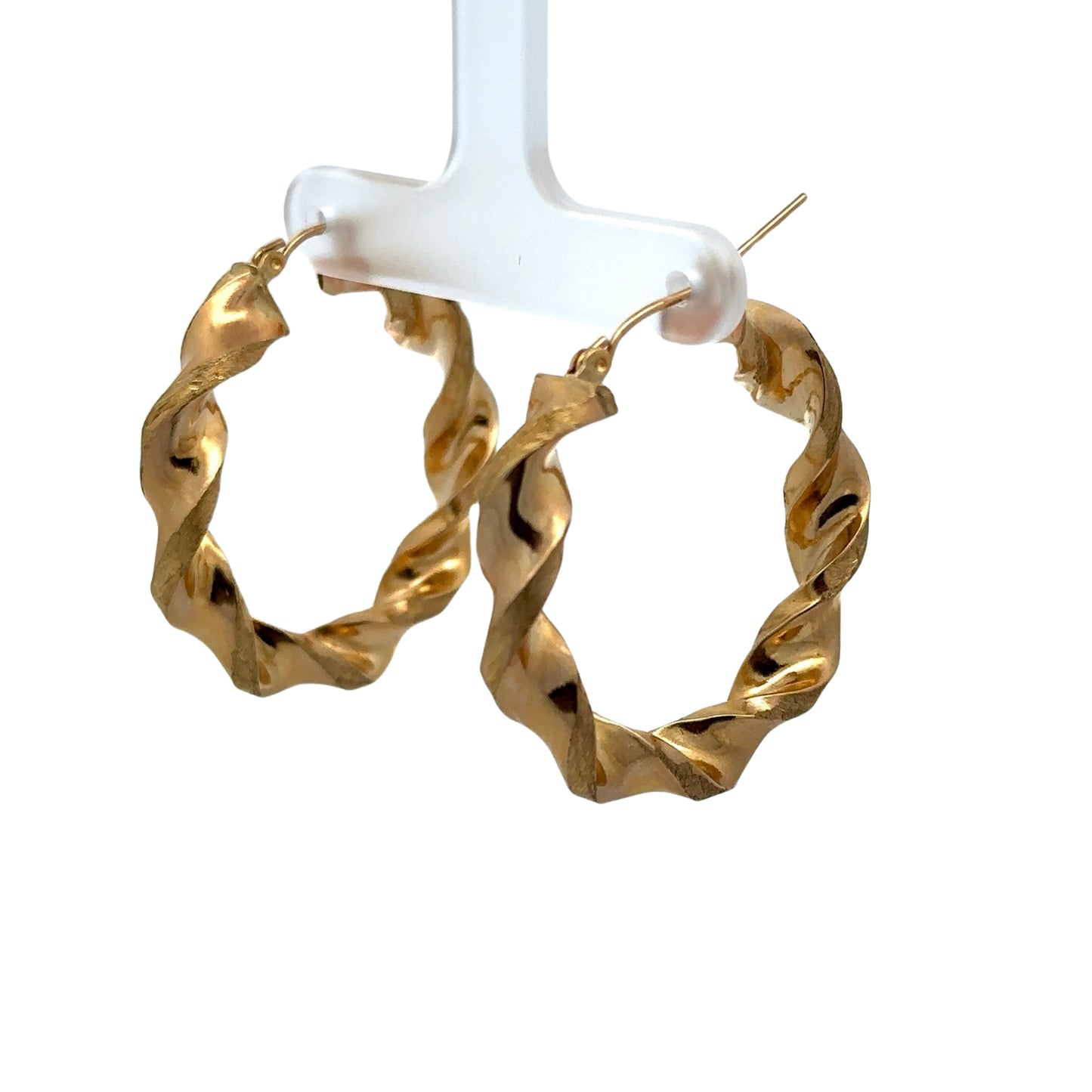 Diagonal view of yellow gold thick twist hoops
