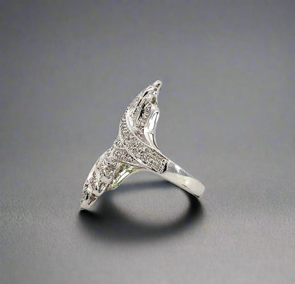 Side of white gold and diamond ring with faint scratches on gold