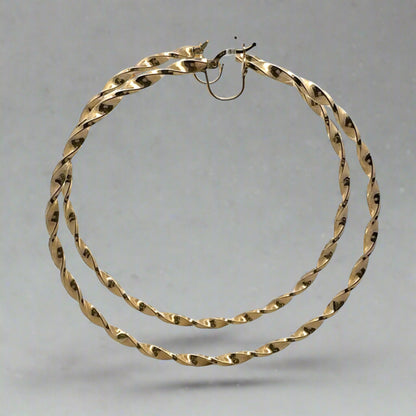 Side of Twist hoops in yellow gold