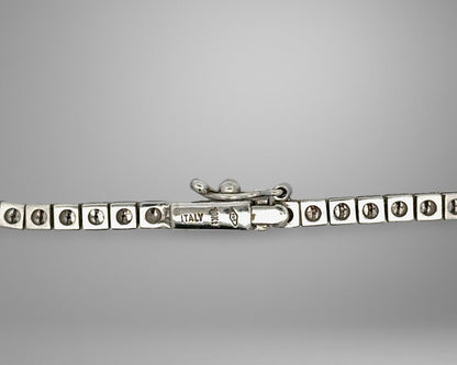 White gold clasp with 18K stamp and 1 safety lock