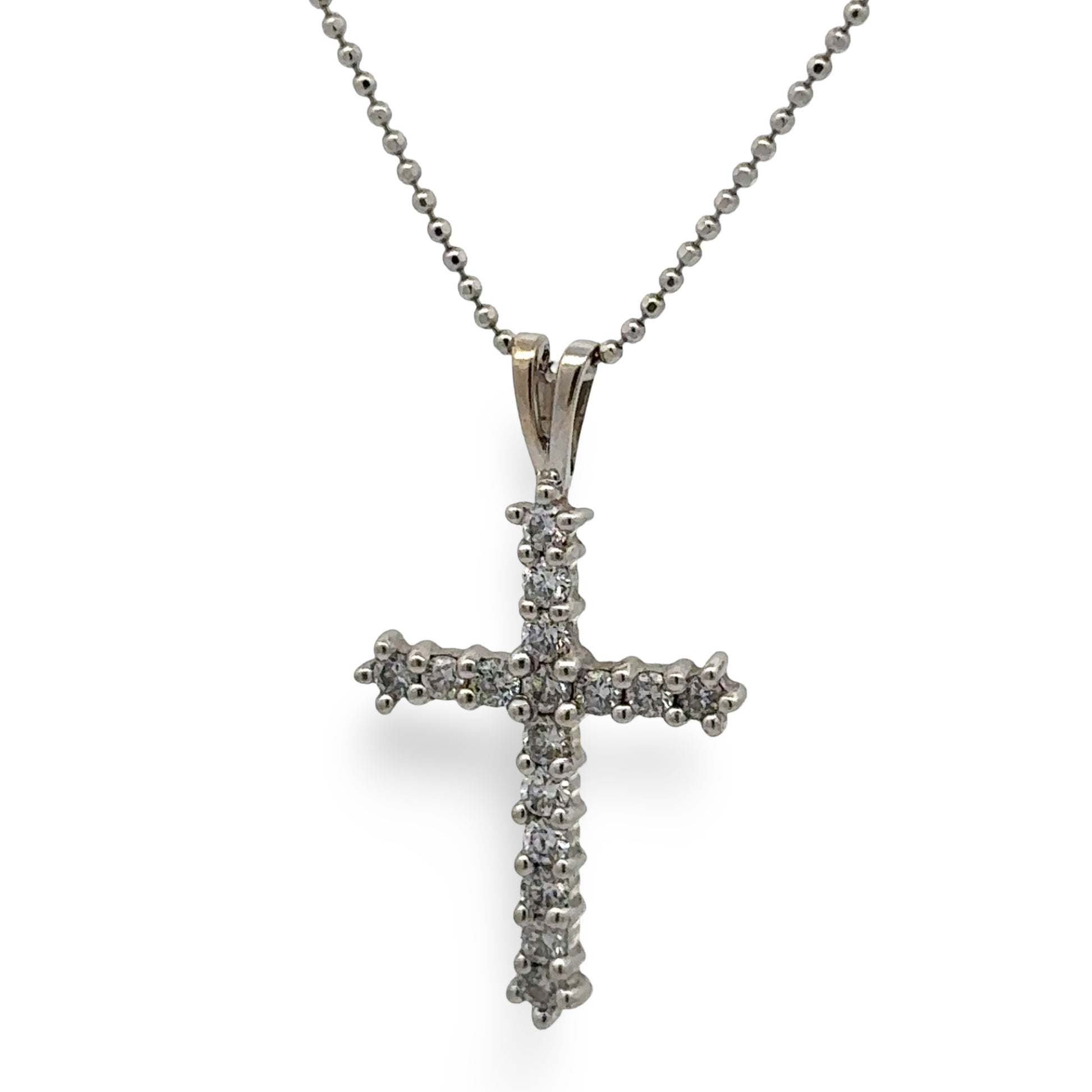 white cross pendant necklace on a white background