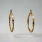 back of yellow gold twist hoops