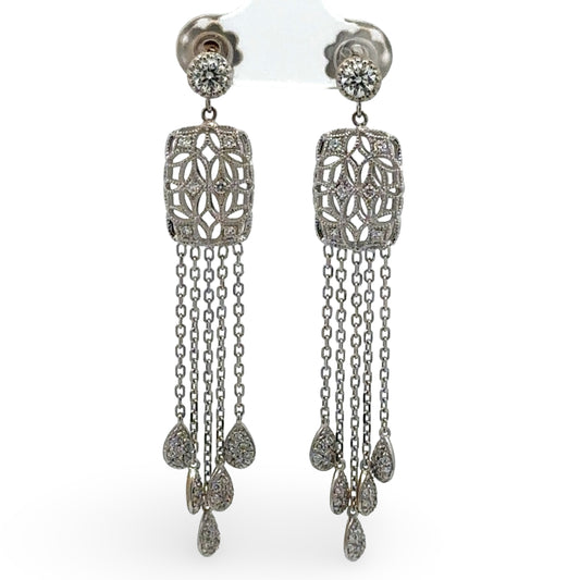 White gold diamond chandelier earrings with intricate designs on a white background
